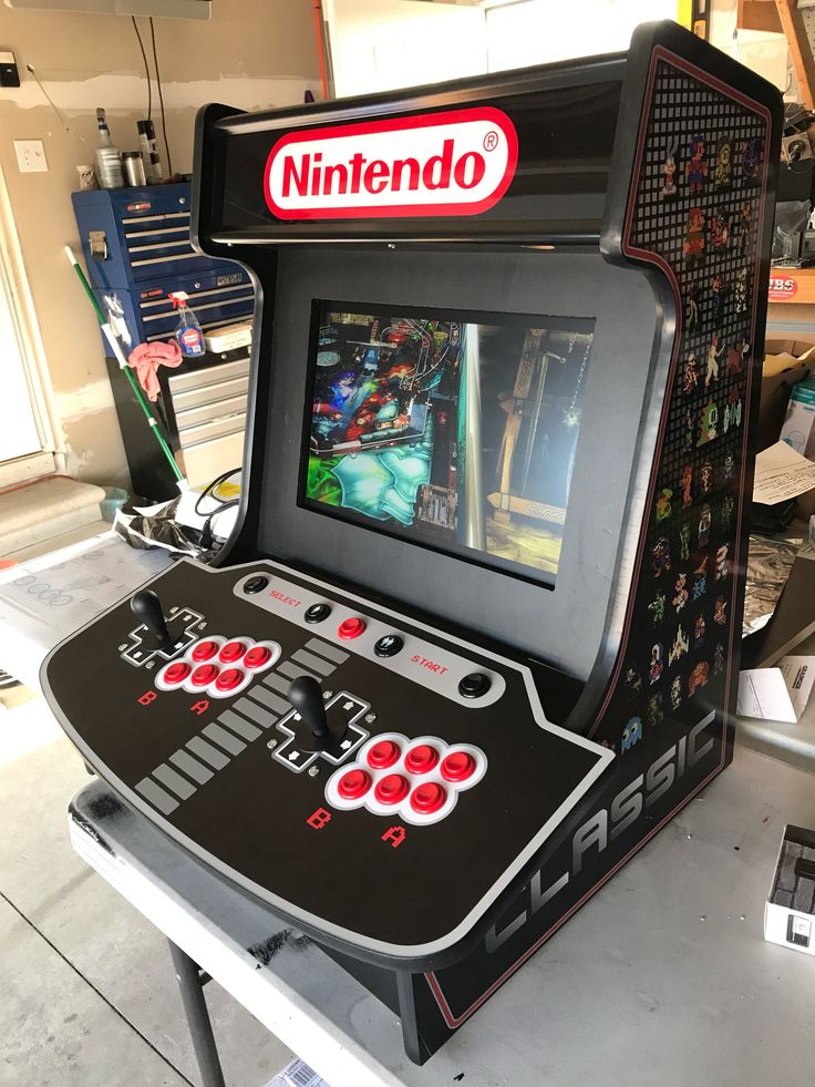 an old school video game with the nintendo logo on it's screen and buttons