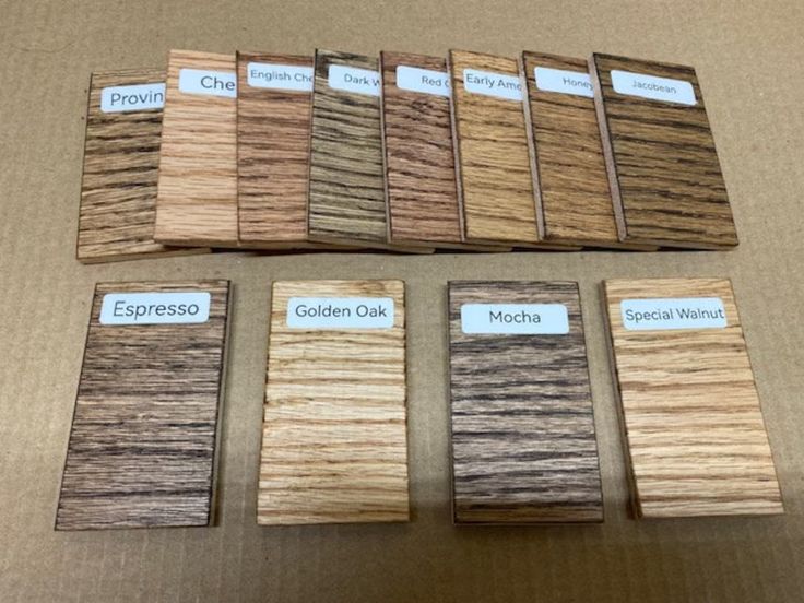 some samples of wood from different countries are displayed on a table with labels for each one