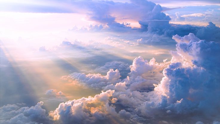 the sky is filled with lots of clouds and sun beams shining down on top of them