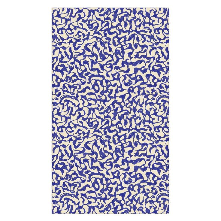 a blue and white rug with an abstract design on the bottom, in front of a white background