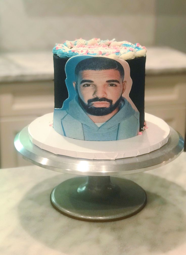 a cake with a photo of a man on it