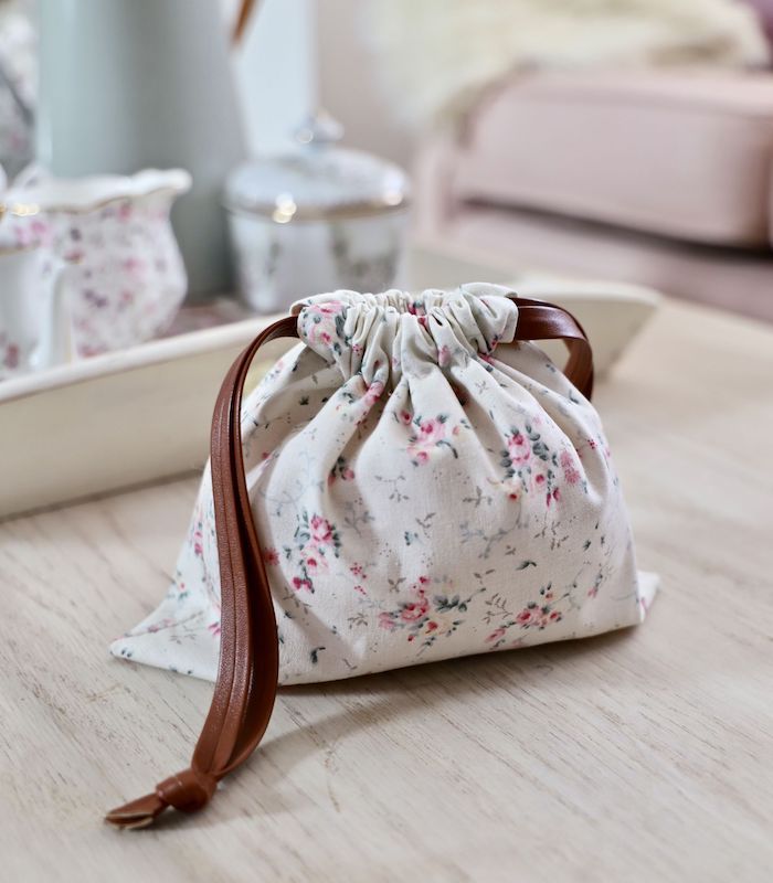 a small bag sitting on top of a wooden table