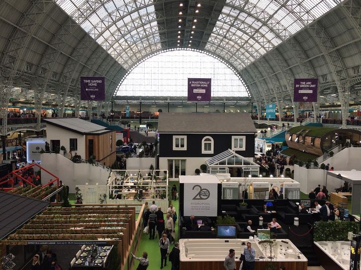 an indoor market with lots of stalls and tables