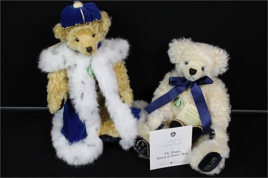 two teddy bears are dressed in winter clothing