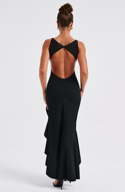 Theadora Maxi Dress - Black Stretch Backless Dress With Ruffles, Elegant Stretch Maxi Dress With Ruffles, Fitted Chic Maxi Dress With Closed Back, Chic Fitted Maxi Dress With Closed Back, Stretch Ruffled Maxi Dress, Stretch Maxi Dress With Ruffles, Elegant Low Back Maxi Dress For Gala, Evening Maxi Length Mermaid Dress With Ruffles, Backless Ruffled Maxi Dress For Prom