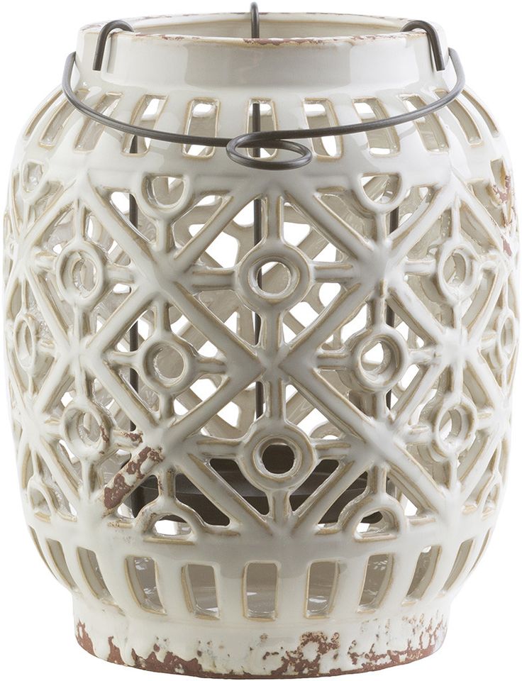 a white vase with an intricate design on it