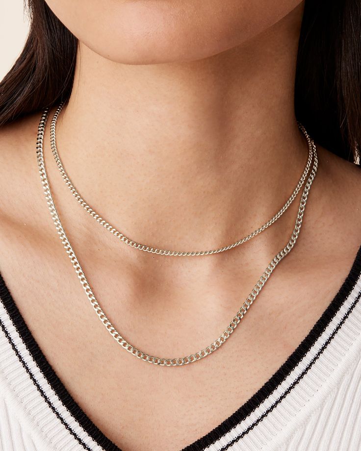 Trendy, modern and ideal for everyday wear - our layered curb link chain necklace is the perfect addition to your everyday OOTDs.Materials: 14K yellow, rose or white gold plated. Measurements: Medium Chain: 14"+2" extender, Width 2.6mm; Large Chain: 16"+3" extender, Width: 4.7mm. Necklace Layered, Dangle Necklaces, Toggle Bracelet, Link Chain Necklace, Bracelet Collection, Layered Necklace, Chain Link Necklace, Yellow Rose, Pearl Ring