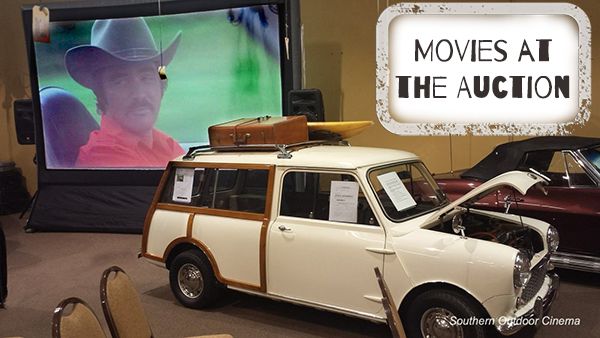 an old car is parked in front of a movie screen with the words movies at the auction on it