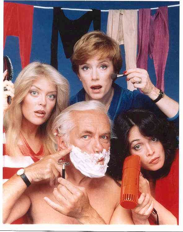 an old man is shaving his face while two women are brushing his teeth and another woman looks on