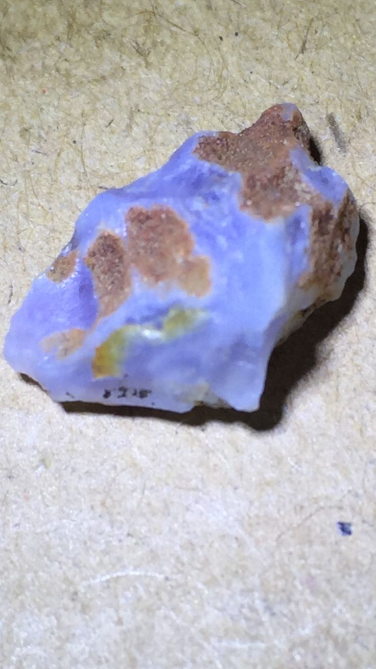 a purple rock sitting on top of a counter