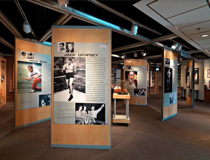 an exhibit room with posters and pictures on the walls, including baseball players'photos