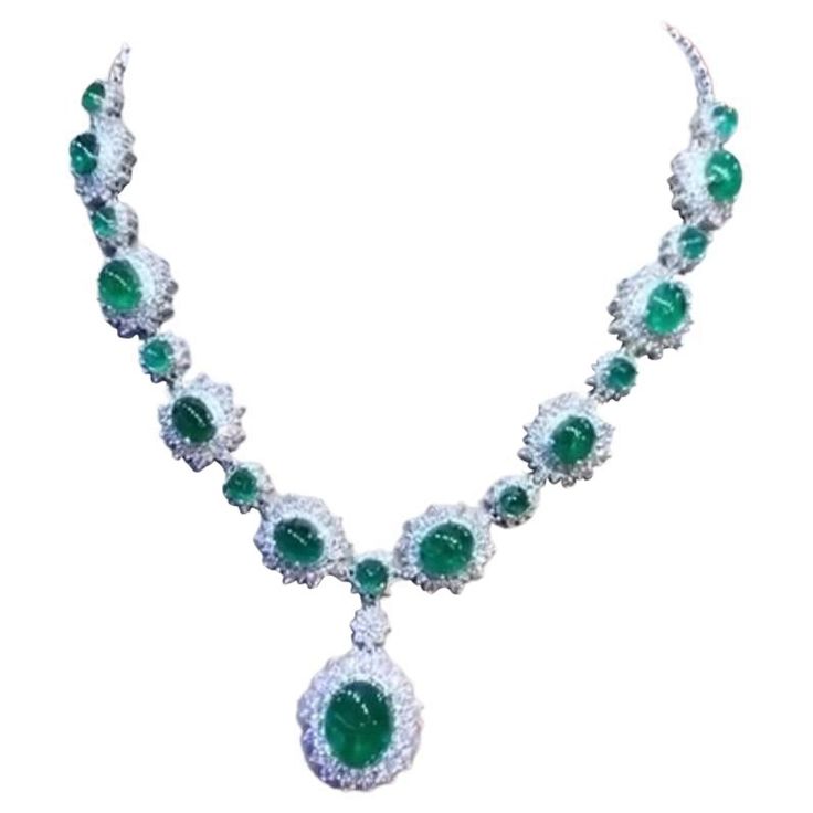 An exquisite design , very glamour and refined, by Italian designer , a very piece of art. Necklace come in 18k gold , with 18 pieces of natural Zambia emeralds, oval cabochon cut, fine quality , of 46,80 total carats. Pendant emerald is of 12,56 carats. Necklace come with natural diamonds of 13 carats,F/VS top quality. On this necklace , pendant is mobile, but on request , I can do fix . It is a high jewelry piece. Handcrafted by artisan goldsmith. Excellent manufacture and quality. Complete with AIG report. Whosale price. Note: on my shipment, customers not pay taxes and duty. Fairy Jewelry, 18k Gold Necklace, Zambian Emerald, Expensive Jewelry, 18k Gold Ring, Italian Designer, Zambia, Emerald Diamond, High Jewelry