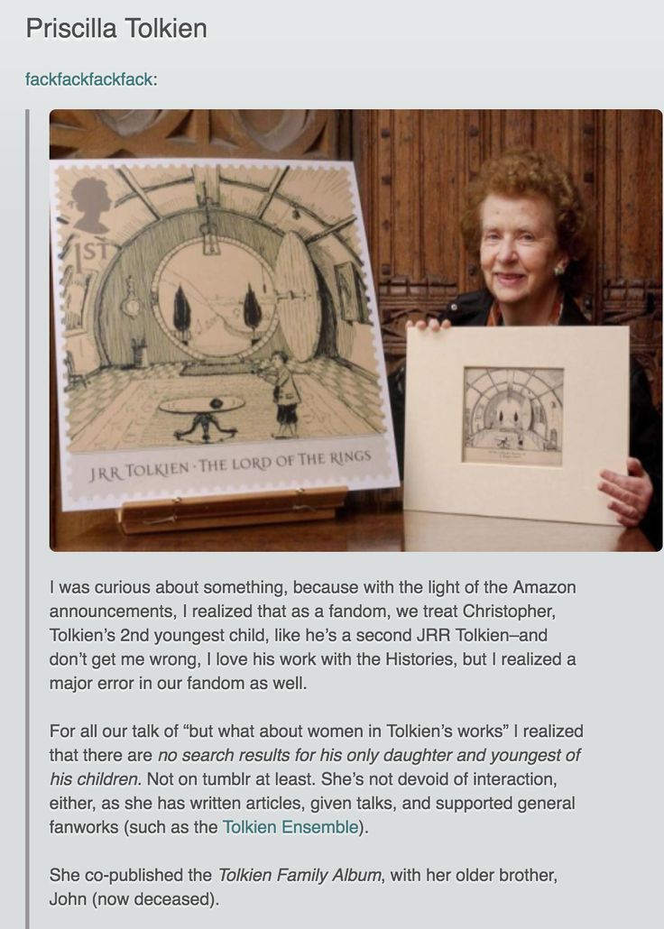 an image of a woman holding up a drawing