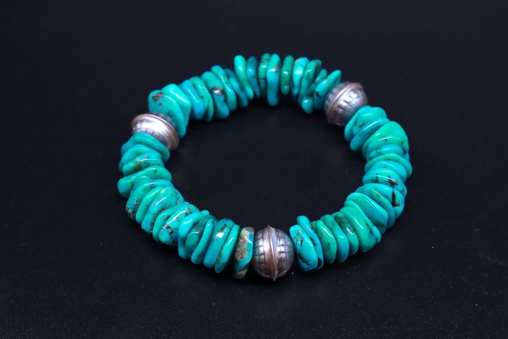 This is Santa Fe style bracelet, big sterling silver Native stamped beads with high quality natural turquoise. Want a hint of southwest Santa Fe, here it is. Turquoise stretch bracelet with native stamped sterling silver beads. All handcrafted by local native artisans with highest quality beads. Great for a man or a woman.  Turquoise Stretch Bracelet Santa Fe Bracelet Native Jewelry Unisex Jewelry Big Turquoise Beaded Bracelet A Living Stone All Native Americans believe that the earth is living Southwestern Silver Bracelets With Gemstone Beads, Southwestern Silver Bracelet With Gemstone Beads, Southwestern Turquoise Bracelets With Polished Beads, Southwestern Style Turquoise Bracelets With Polished Beads, Southwestern Style Turquoise Polished Beads Bracelet, Indigenous Design, Expensive Stones, Jewelry Big, Santa Fe Style