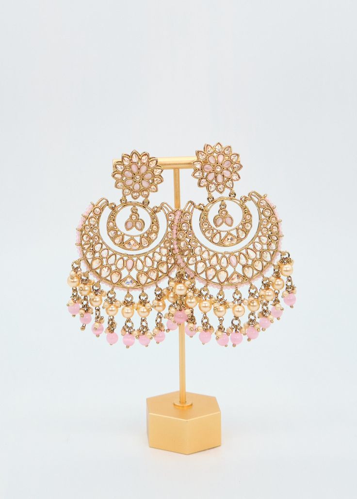 These Polki earrings are a classic addition to any traditional outfit with their stunning stones, crystals, and pearls. They add an exquisite charm and make for the perfect accessory to complete your look. Earrings length: Approx. 3.5" Weight of each earring: 31 gms Push-Back Closure. Antique Gold Plated on high-quality brass as the base metal In-stock & ready-to-ship Color may vary slightly due to light condition & photography. Jewelry Care: Keep away from moisture. Allow perfumes and lotion to Earrings Chandbali, Pearl Tassels, Pakistani Earrings, Tassels Earrings, Photography Jewelry, Polki Earrings, Chandbali Earrings, Traditional Outfit, Earrings Indian