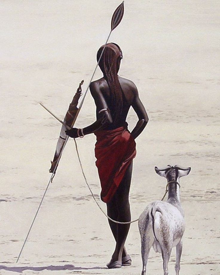 a person with a stick and a goat on the beach