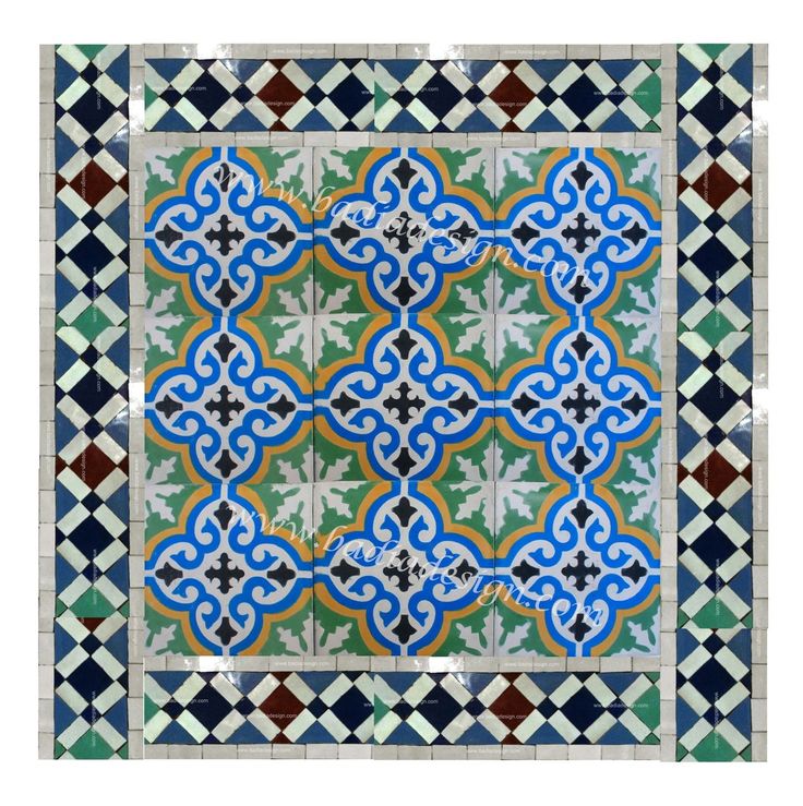 a blue and green tile design on the side of a building with an intricate pattern