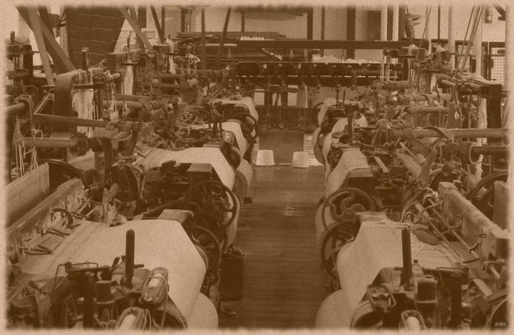 an old photo of several machines in a factory