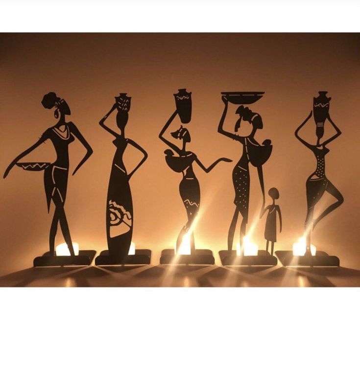 the silhouettes of three women are on display