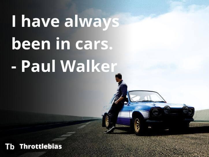 a man sitting on top of a blue car next to a road with the words i have always been in cars - paul walker