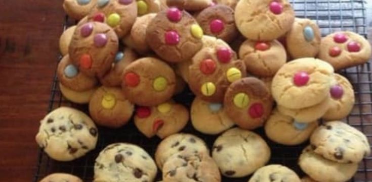 chocolate chip cookies with sprinkles are on a cooling rack