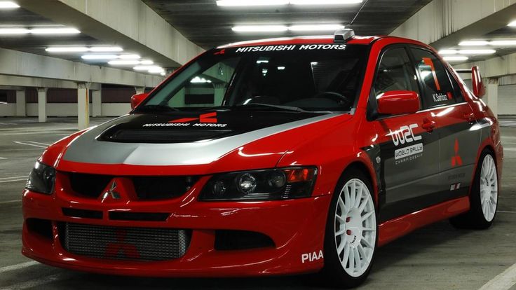 a red car parked in a parking garage