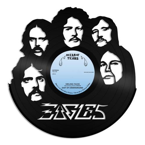 an old vinyl record with the faces of several men on it, in black and white