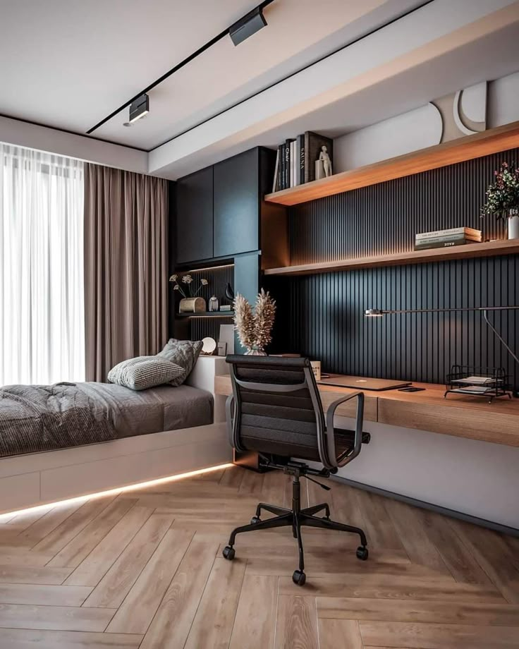 a room with a bed, desk and chair in it