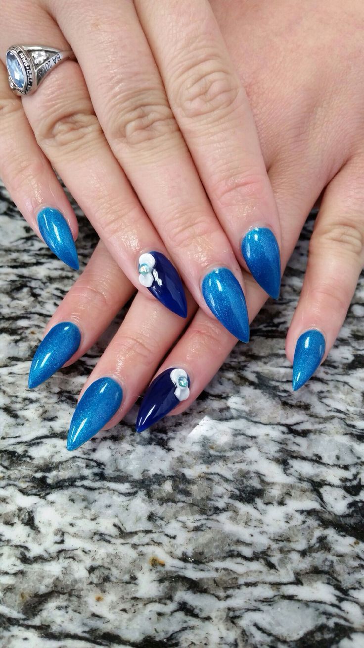 Blue stiletto nails Blue Stiletto Nails, Blue Stilettos, Fringe Hair, Full Service Salon, Stiletto Nails Designs, Facial Spa, Fringe Hairstyles, Winter Nail Designs, Popular Nails