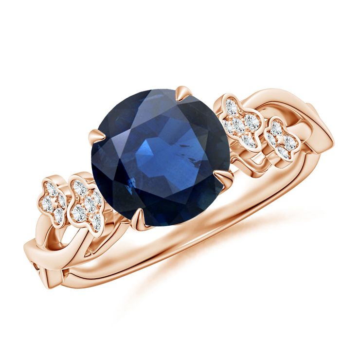 an oval blue sapphire and diamond ring in 18k rose gold with diamonds on the band