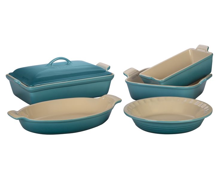 three blue casserole dishes, one with an oval dish and the other with a rectangular bowl