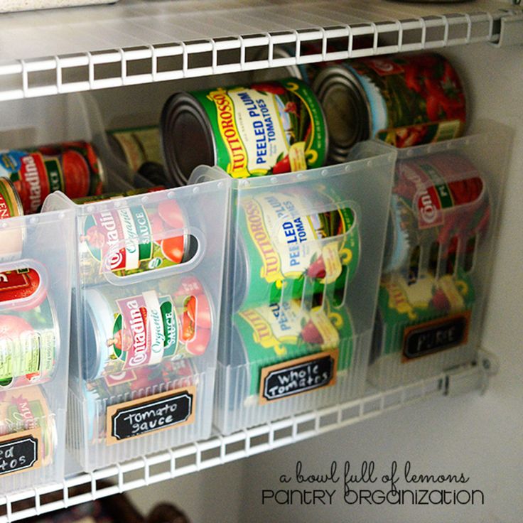 an organized pantry with canned food in bins