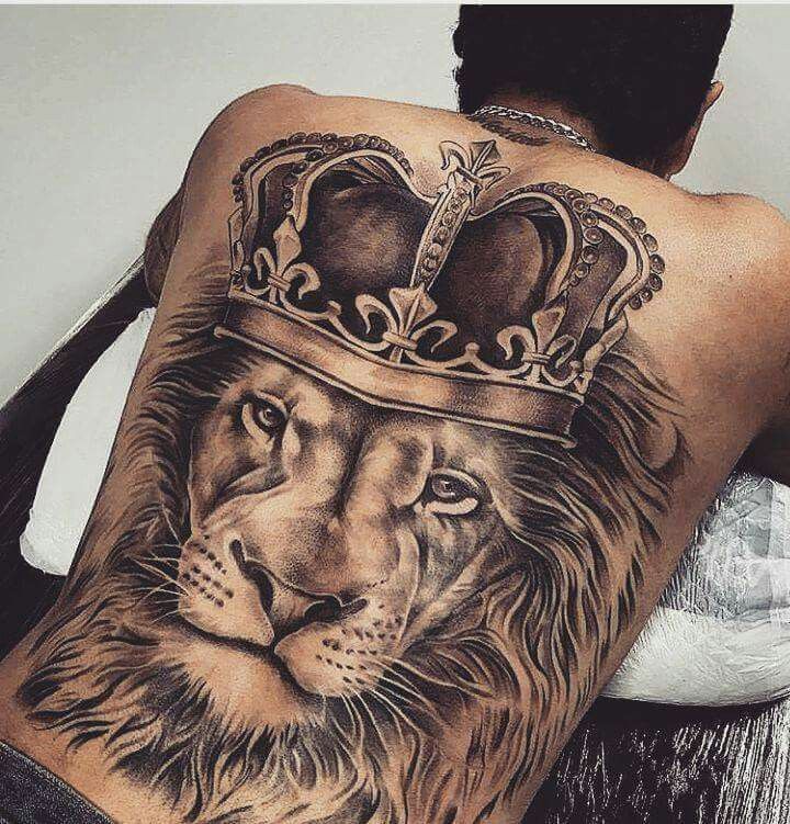 a man with a lion tattoo on his back has a crown on top of his head