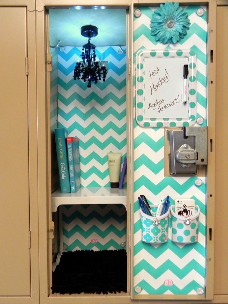 a locker with blue and white chevroned paper on the door, some items in front of it