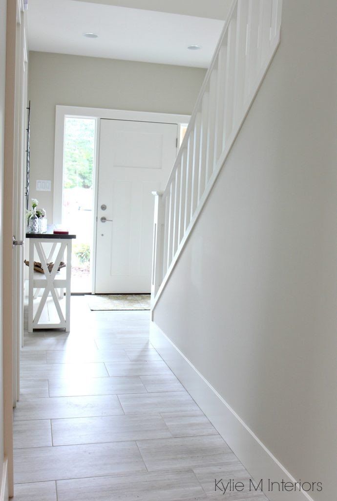 a white door and some stairs in a house