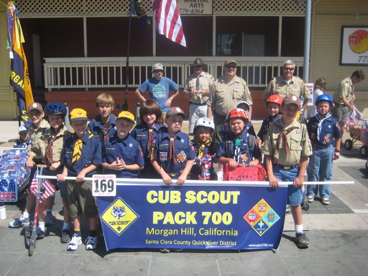 the scouts are posing for a group photo holding a sign that says cub scout pack 700