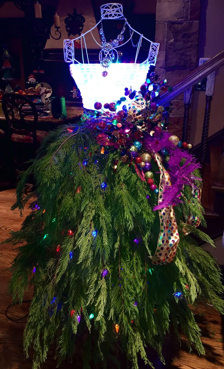 a christmas tree with lights and decorations on it