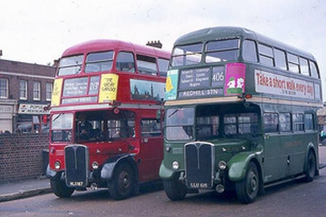 two double decker buses parked next to each other