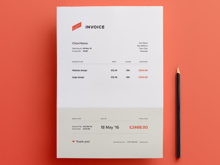 a white invoice sitting on top of a red table next to a pencil