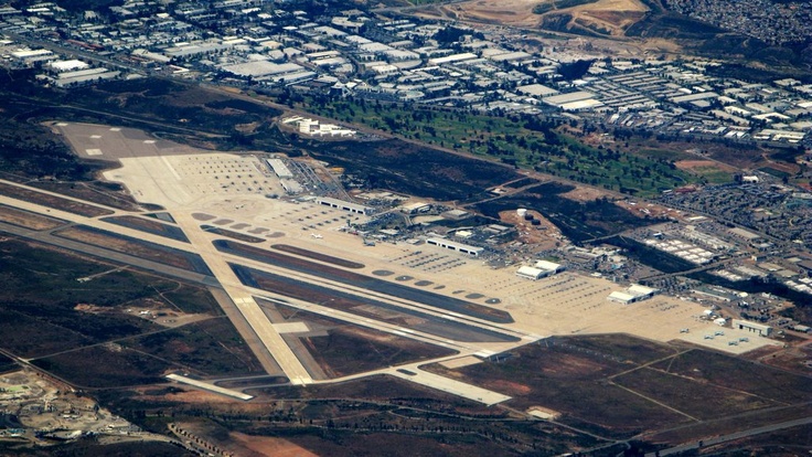 an aerial view of the airport and runway