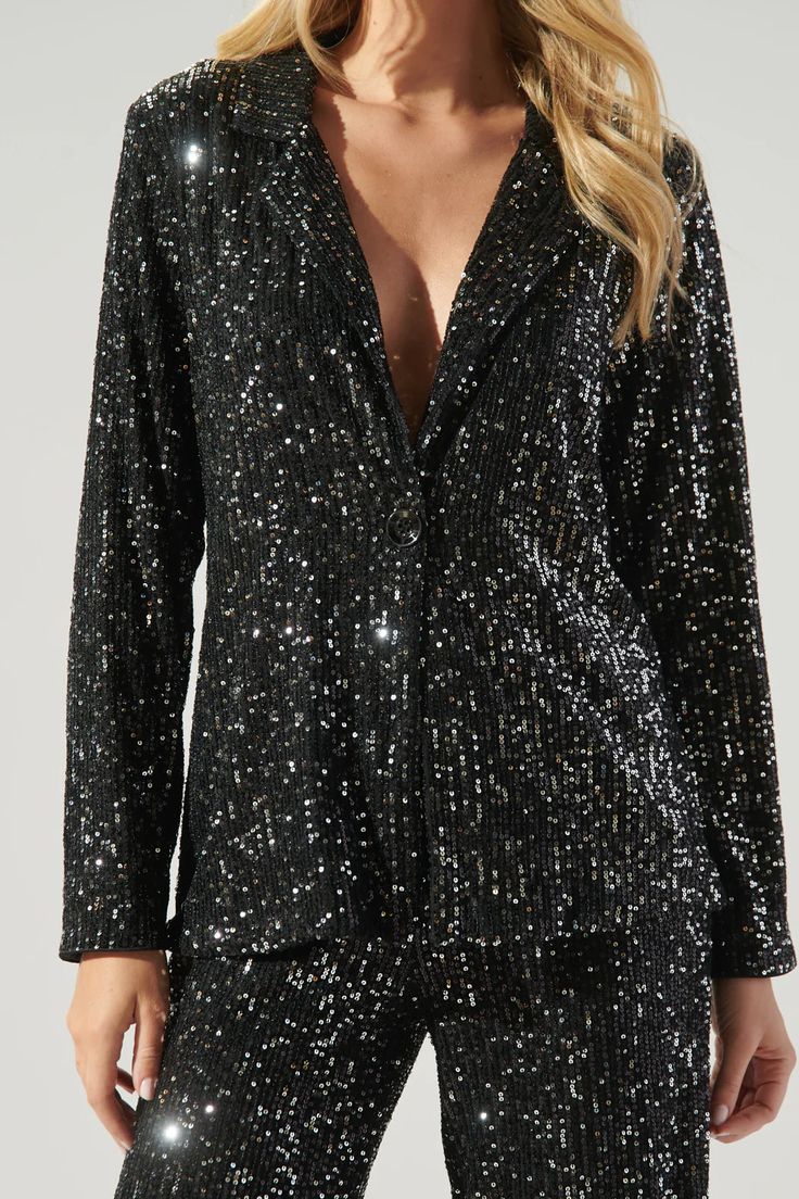 Hit the dancefloor and be the talk of the town in this electrifying jacket. This neo disco look is everything and more. Sequins make this blazer style jacket, highlighting a notched lapel and single button with a slightly tailored fit. Its the perfect piece to elevate any outfit. Wear it on its own, or style it with the matching pants.- Sequins- Tailored- Single button- Lapel- Comes in 2 colorsSize + Fit - Model is 5'10" and wearing size XS- Measurements taken from size S - Chest: 19"- Length: 2 Disco Look, Friday Nights, Talk Of The Town, Blazer Style, Floral Jacket, Tailored Blazer, Matching Pants, The Talk, Cropped Blazer