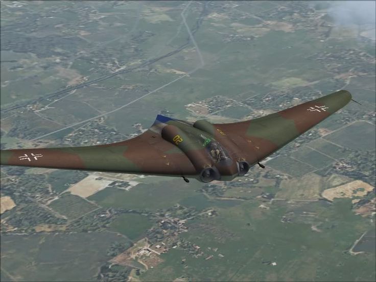 an air force jet flying through the sky over land and fields in front of a city