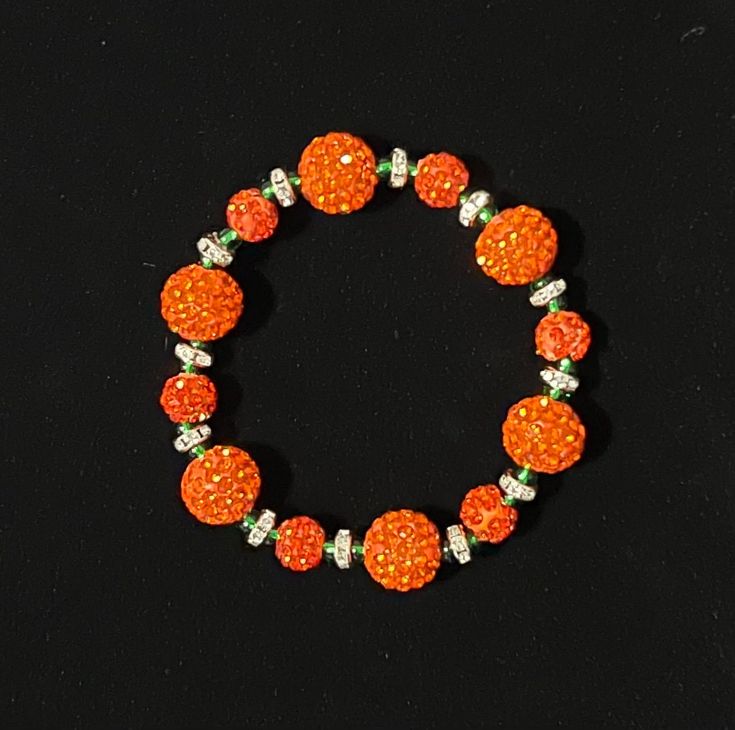 Being charm to all of your fall outfits! Sparkle and gleam with these festive pumpkin-esque, handcrafted, beaded stretch bracelets! Festive Adjustable Beaded Bracelets, Orange Stretch Bracelet With Large Beads As Gift, Adjustable Beaded Stretch Bracelet For Festive Occasions, Gift Orange Stretch Bracelet With Large Beads, Orange Round Beads Party Bracelets, Festive Beaded Stretch Bracelet, Casual Orange Jewelry With Large Beads, Festive Adjustable Beaded Stretch Bracelet, Adjustable Orange Stretch Bracelet With 8mm Beads