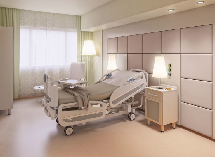 a hospital room with a bed, dresser and lamp