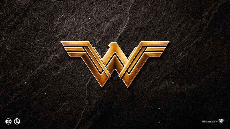 the logo for wonder woman is shown on a black stone surface with gold foil lettering