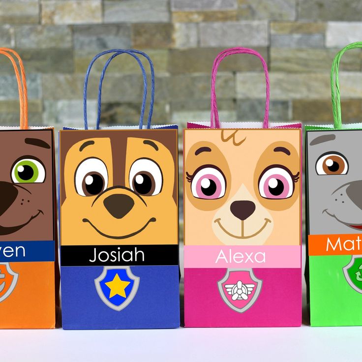 three bags with different colored dogs on them, one has eyes and the other has ears