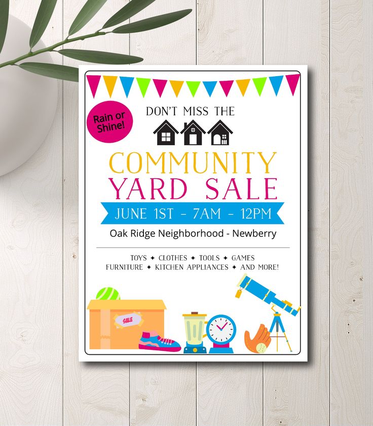 a flyer for a yard sale on a wooden table