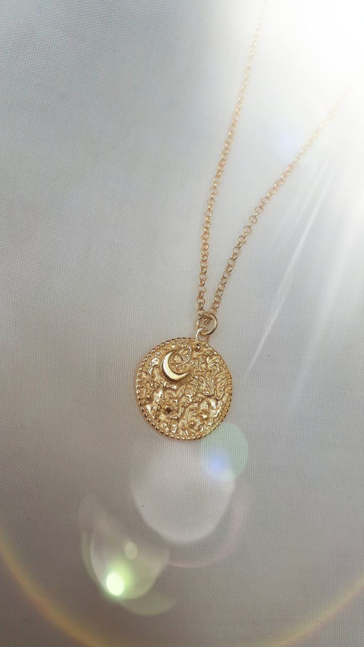 "This Night's Sky coin pendant is etched from original illustrations and is embellished with a tiny crescent Moon and tiny stars. Edged in delicate granulation, this is the perfect delicate gold necklace for layering. The necklace is made from sterling silver and is plated in 18ct yellow gold.  Width of coin: 1.8cm Length of chain: 18\" chain with an adjuster at 16\"" Delicate Gold Necklace, Tiny Star, Gold Coin, Layered Jewelry, Letter Necklace, Coin Pendant, Gold Coins, Dainty Jewelry, Crescent Moon