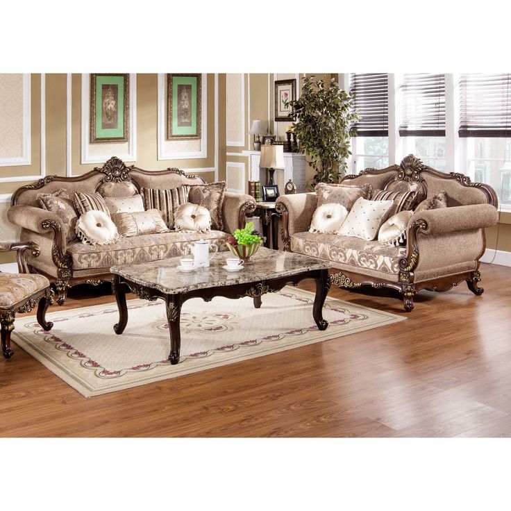 a living room filled with furniture on top of a hard wood floor covered in lots of windows