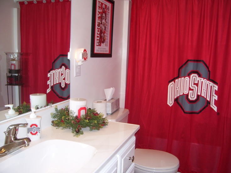 a bathroom decorated for christmas with the word ohio state on it's shower curtain